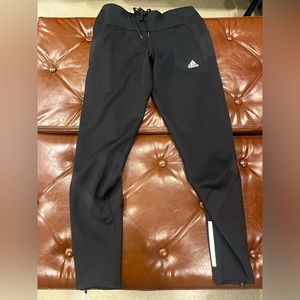 Black adidas joggers with reflectors and pockets